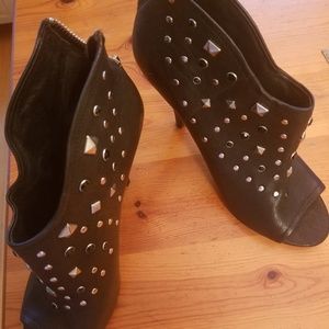 Black leather booties with silver studs and black